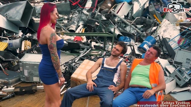 Redhead MILF with Big Silicone Tits and Tattoos Fucks two Garbage Men in Junkyard